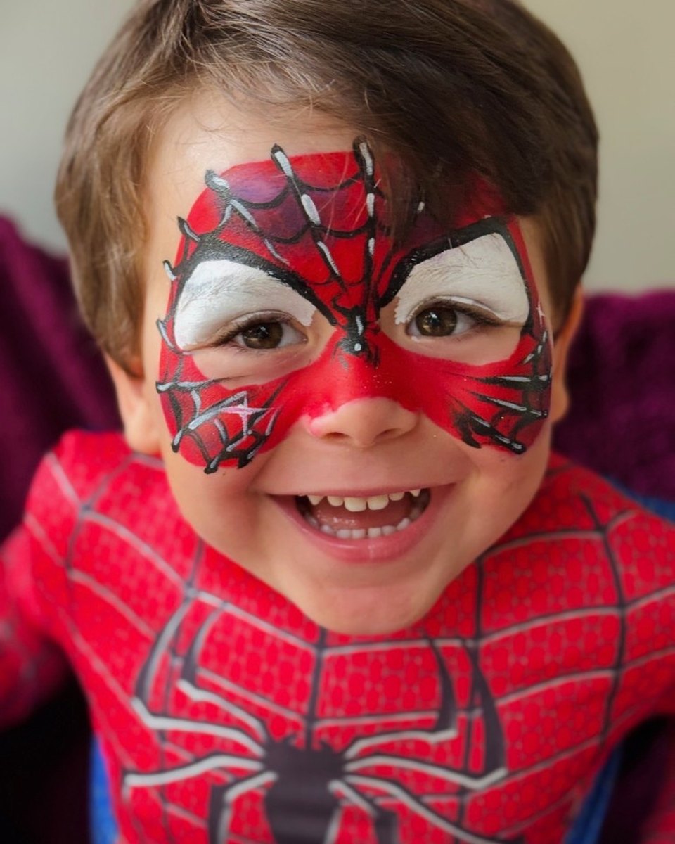 Child with Spider-Man mask face painting by Wildflower Face Art